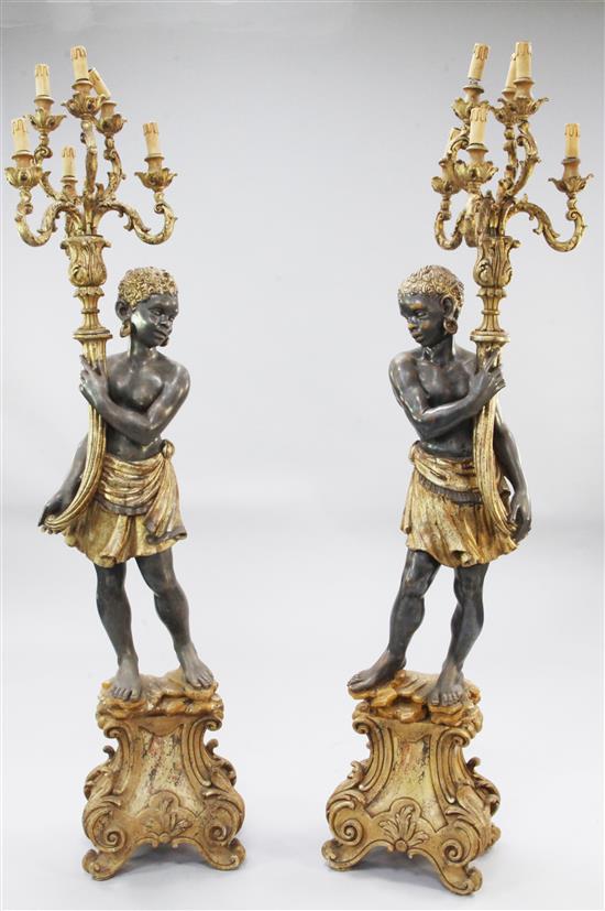 A pair of Venetian style carved blackamoor figures, H.5ft 9in.